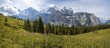 © Moritz Wolf/imageBROKER - Two (hikers) on a hiking trail, in front of the Eiger north face, behind mountains and mountain tops, steep face and mountains, Jungfrau region, Lauterbrunnen, Bernese Alps, Switzerland