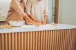 © PIC SNIPE - Senior Couple Baking Together at Home Kitchen
