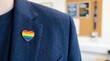 © Alex Pios - Rainbow Stripe Heart Pin Badge, Smart Casual Jacket, Close Up, Minimal. LGBTQ+ Pride Month at Work. Equality, Diversity, Human Rights. Awareness, Social Responsibility, Entrepreneur, Manager, Employee