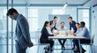 © SashaMagic - Isolated employee looking down in shame during a tense office meeting, representing workplace conflict and exclusion