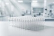 © Tima - Many plastic test tubes arranged in rows on a laboratory table. Medical research equipment and scientific container for sample collection. Clinical analysis and biotechnology concept.