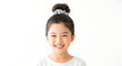 © DigitalStock - Adorable Smiling Young Asian Girl with Top Knot Hairstyle and Colorful Scrunchie Portrait Isolated on White Background Joyful Expression and Healthy Skin
