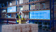 © Grispb - Warehouse worker using a tablet to manage inventory with digital tracking system. Smart logistics and automated stock monitoring in a modern storage facility.