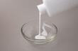 © Elena - White glue mixture preparation for stiffening Christmas decorations. Perfect for seasonal lifestyle magazines, online needlework courses, craft retail branding, and DIY home decor websites