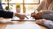 © Nicole - Elderly couple signing legal documents with a lawyer's assistance, emphasizing trust and crucial financial decisions.