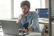 © Westend61 - Focused programmer analyzing code on laptop computer in office