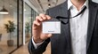 © Ruslan Abdullin - Businessman Showing Visitor Access Identification Card in Modern Office