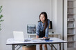 © David - Businesswoman analyzing corporate data for financial report
