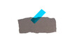 © kebox - Graues Papier mit Klebestreifen in blau als Hinweis