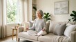 © mashimara - Serene elderly Asian woman meditating peacefully on a comfortable couch at home