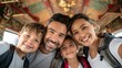 © Premium_art - A joyful family of four posing together with bright smiles and backpacks.