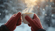 © Hamdan - Cozy winter moment with steaming hot coffee in red knitted gloves during snowfall