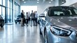 © Bisca - Modern car in a luxury dealership showroom with sales team and customers talking in the background