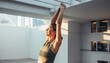 © sunsan.id - Woman Stretching Arms Overhead in Sunny Minimalist Studio