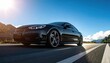 © Lan - Sleek Black Sports Car Driving on Scenic Highway Under Bright Sunny Sky.
