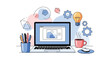 © RAMS - Laptop with office supplies and gears for digital work and creativity