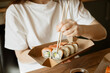 © ADDICTIVE STOCK - Enjoying sushi at home on a relaxing day off