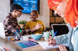 © ADDICTIVE STOCK - Diverse team collaborating on startup project in office
