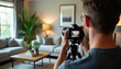 © miss irine - Male photographer takes pro photos of modern living room interior decor. Man uses camera on tripod to shoot stylish home furnishings, furniture, and design elements for real estate.