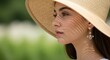© Mustakim - Woman Wearing Straw Sun Hat Outdoors.