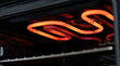 © CK Studio - Electric oven heating element glowing bright orange-red inside domestic kitchen appliance, symbolizing warmth and cooking preparation.