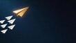 © Piemon - Glowing golden paper airplane leading white airplanes on dark blue background, business leadership and innovation concept.