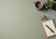 © Ryzhkov - Muted sage green desk surface background with a laptop and coffee mug for professional productivity blogs, office supplies catalogs and minimalist workspace styling