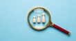 © Unique Icons - Magnifying glass focuses on three wooden figures representing investigation and detailed examination