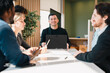 © chokniti - Business professionals discussing ideas in urban setting corporate communication teamwork consultation partnership strategy planning modern workplace collaboration