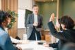 © chokniti - Business professionals discussing ideas in urban setting corporate communication teamwork consultation partnership strategy planning modern workplace collaboration