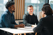 © chokniti - Business professionals discussing ideas in urban setting corporate communication teamwork consultation partnership strategy planning modern workplace collaboration