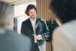 © chokniti - Business team meeting discussion collaboration presenting data analysis corporate teamwork diverse professionals planning strategy office communication partnership
