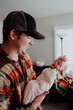 © Cavan Images - Young Father holding newborn baby girl