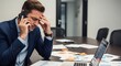 © Maryia - Decision fatigue during office phone call shows male manager weighing difficult options by meeting table with open laptop, marked notes, leadership burden and mental overload at work.