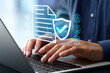 © tadamichi - Legal and regulatory compliance policy. Corporate document verification and management system. Businessman using laptop computer.