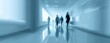 © ucok - Blurred figures move down a brightly lit, reflective hallway