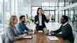 © Belinda - Diverse Group of Professional Business People Having a Productive Meeting and Presentation in a Modern Office