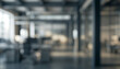 © Vhagar - A blurred view of a modern office interior, showcasing open spaces with desks and workstations, emphasizing a contemporary professional environment.