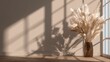 © Ronald - Interior space displays dried ornamental grass in a glass vase next to a sunlit window casting shadows.