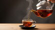 © Tahir.Pro - Tea being poured from teapot into cup on saucer