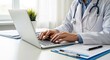 © PexelAura - Doctor working on laptop at desk with medical files while wearing a white lab coat daily.