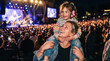 © drimerz - Mother and little girl with ear protection at outdoor music concert