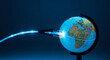 © wiplens - Glowing fiber optic cable plugging into a world globe