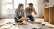 © mfahryf - Young couple assembling furniture together.