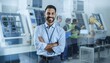 © WS Studio 1985 - Smiling Engineer in Modern Factory: A confident engineer stands in a modern factory setting with arms crossed, exuding expertise and innovation amidst the machinery and fellow workers.