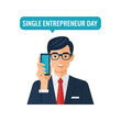 © seba - Businessman holding a cell phone.