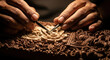 © ruangfootage - Hands meticulously carving intricate details into a wooden sculpture.