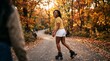 © Таня Андреева - Cheerful young African American woman roller skating on park path in autumn.