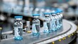 © Akash - Vaccine vials moving on an industrial conveyor belt