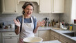 © Infinity in the lens - Happy woman celebrating while cooking in kitchen, joyful lifestyle and homemade food concept, creativity and fun, natural light, modern home scene with copy space